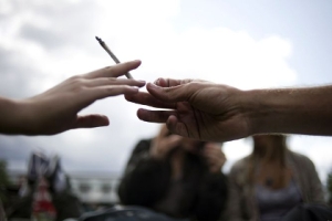 two hands passing a joint